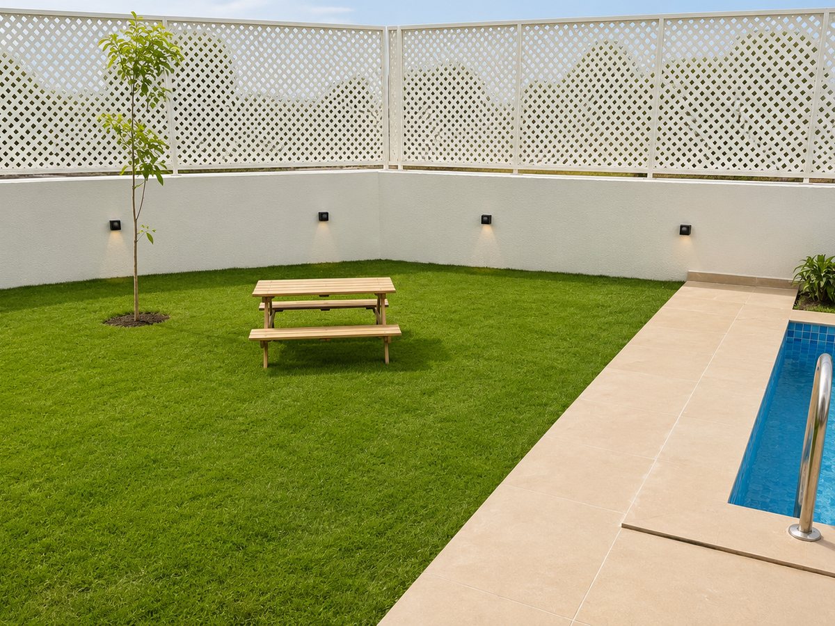 Private lawn next to the pool at RYST 109A beach villa, Pearl Beach, Cheyyur