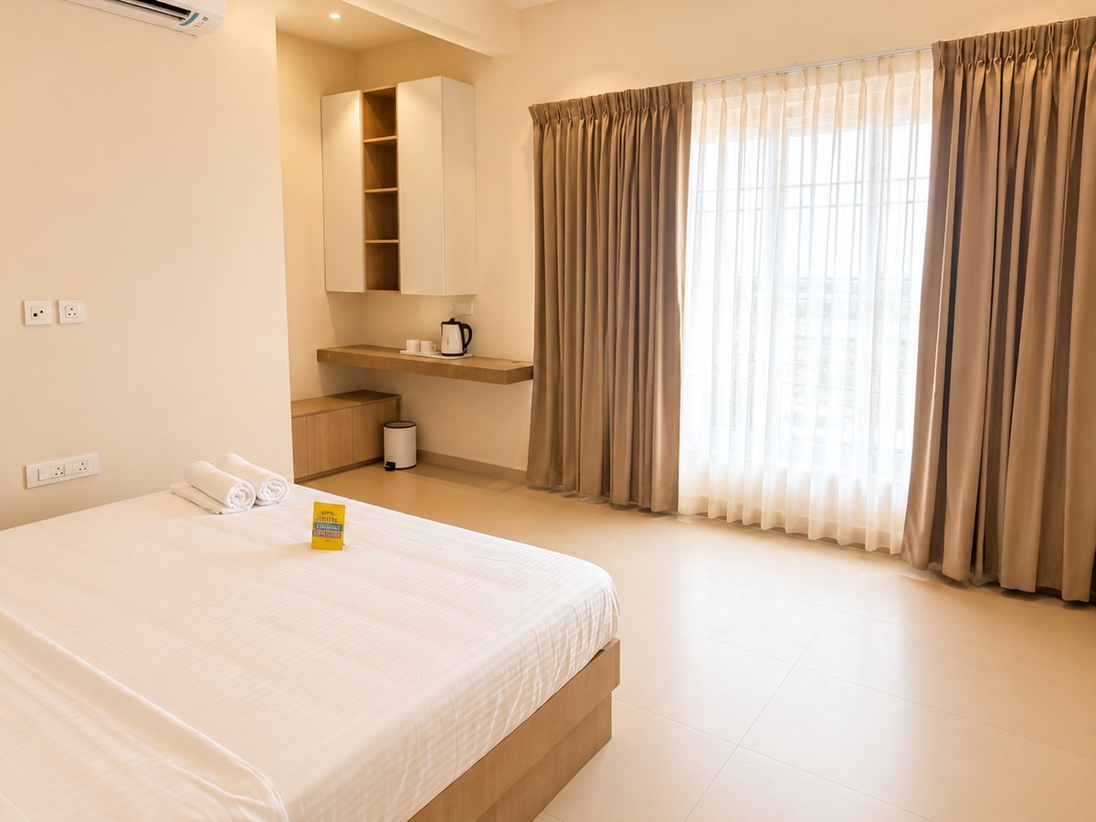 Bedroom with tea station and window at RYST 109A beach villa, Pearl Beach, Cheyyur